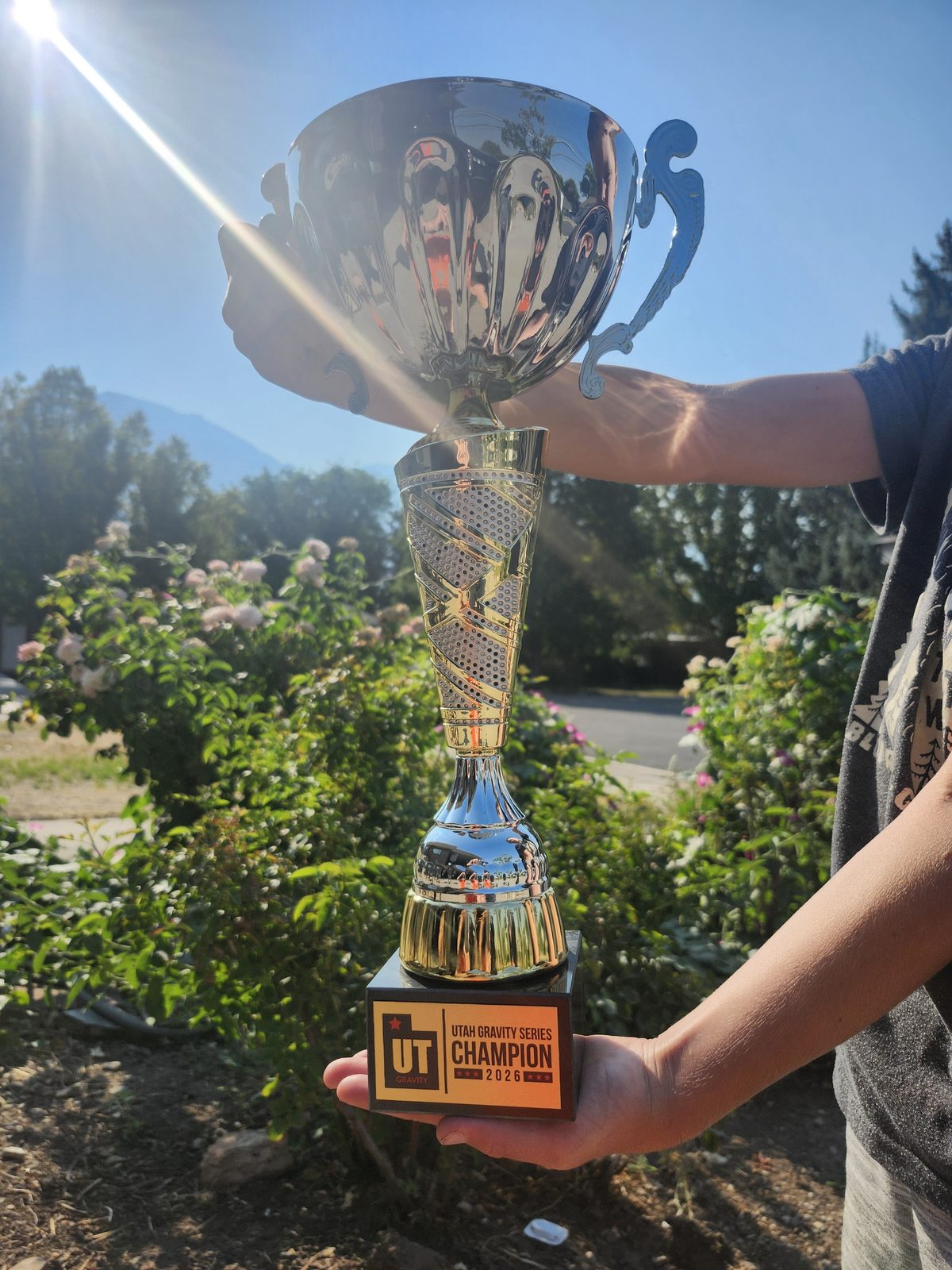The 2026 Utah Gravity Series Champion trophy — a gold and chrome cup on a plaque reading Utah Gravity Series Champion 2026